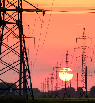 Image of some Electrical pylons during a sunset